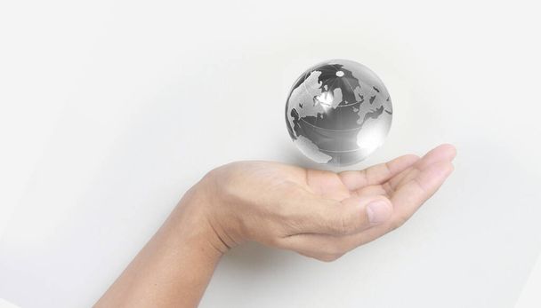 Glass globe in hand,Energy saving concept, Elements of this image furnished by NASA - Fotó, kép