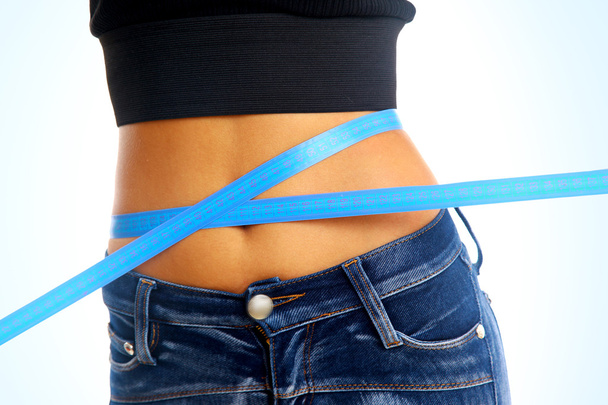 Measure tape around slim beautiful waist. - Foto, Imagem