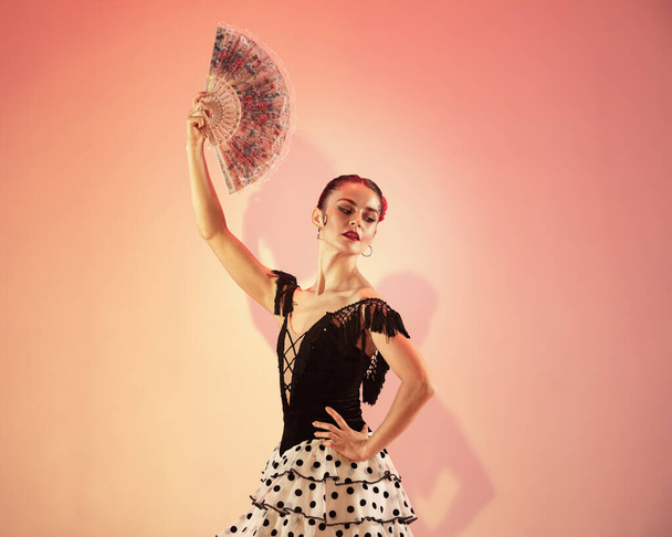 Flamenco dancer Spain woman gypsy with red rose and spanish hand fan - Foto, immagini