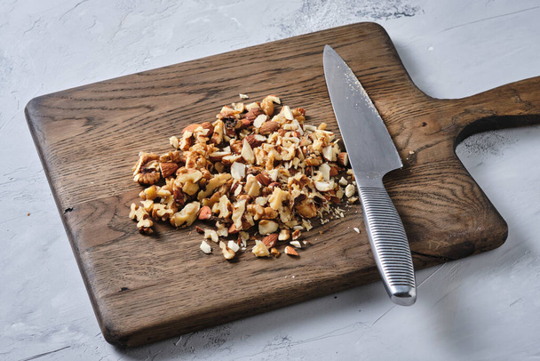 Cooking granola. Sliced walnut. Healthy food. - Photo, Image