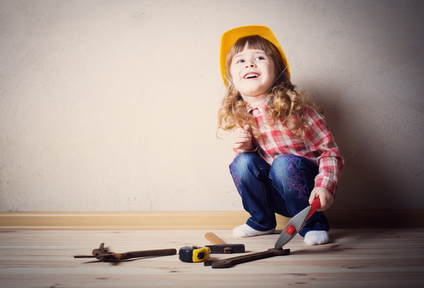 little girl plays in the builder - Photo, Image