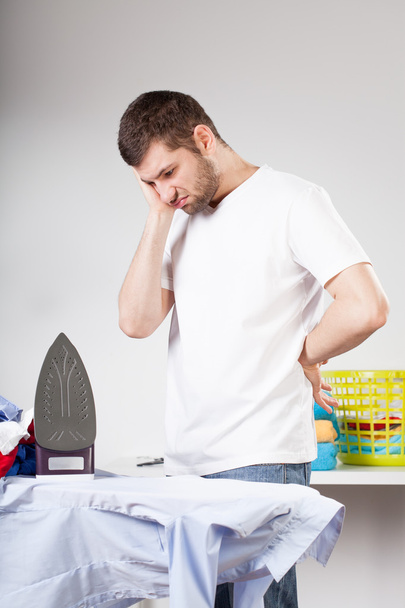 Clumsy man left with ironing - Foto, Imagen