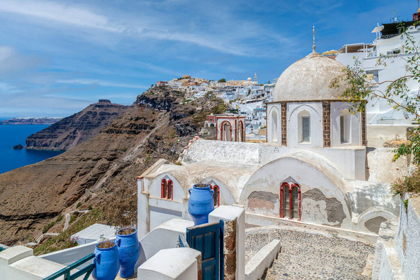 Typical white and blue architecture with domes and churches of Fira (Thira) village on Santorini island, Greece. - 写真・画像
