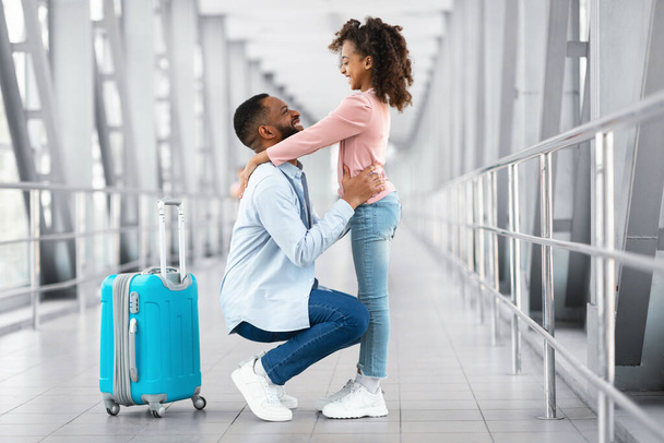 Happy black dad meeting daughter in airport - Photo, Image