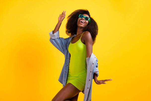 Photo portrait of funky woman laughing cheerful wearing fashionable outfit isolated vibrant yellow color background copyspace - Valokuva, kuva