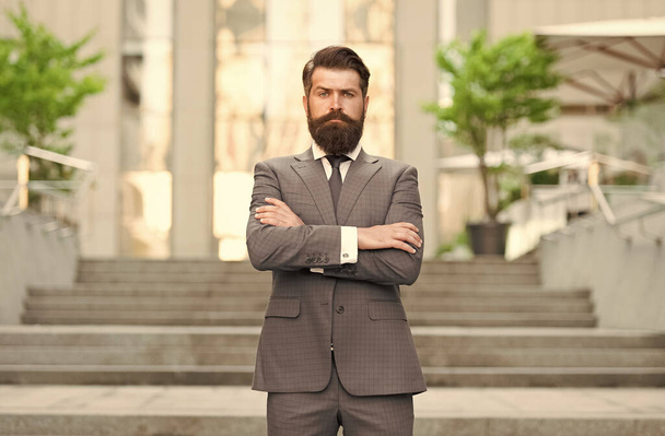 Confident lawyer wear formal fashion suit with serious brutal look keeping arms crossed outdoors, confidence - Foto, imagen