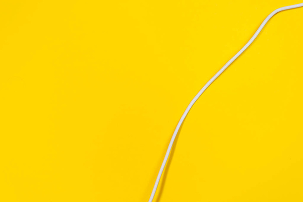 USB wires on a yellow background - Фото, зображення