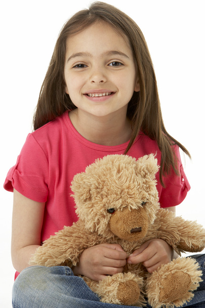 Studio Portrait Of Smiling Girl with Teddy Bear - Foto, Bild