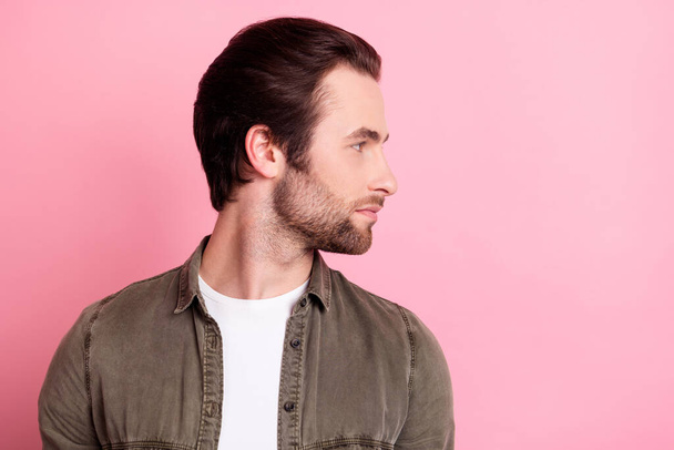 Profile side photo of young handsome guy serious confident look empty space isolated over pink color background - Fotoğraf, Görsel
