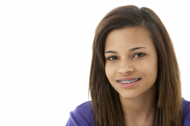Studio Portrait of Smiling Teenage Girl - Фото, зображення