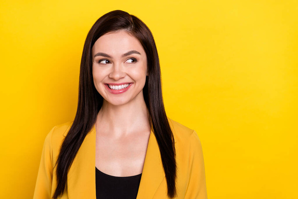 Photo of young cheerful woman happy positive smile curious look empty space isolated over yellow color background - Fotó, kép