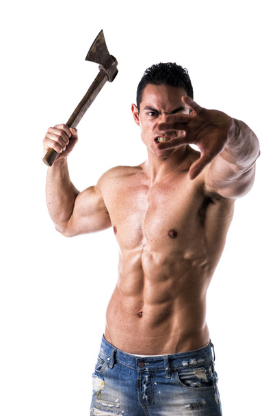 Aggressive, violent muscular young man with axe in his hand - Fotó, kép