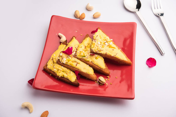 Shahi tukda or tukra also known as double ka meetha is a rich & festive Indian dessert made with bread, ghee, sugar, milk and nuts - Valokuva, kuva