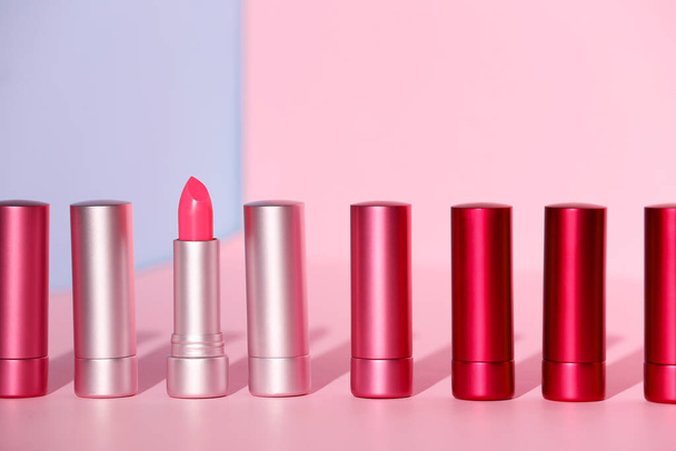 Beautiful lipsticks on color background - Fotoğraf, Görsel