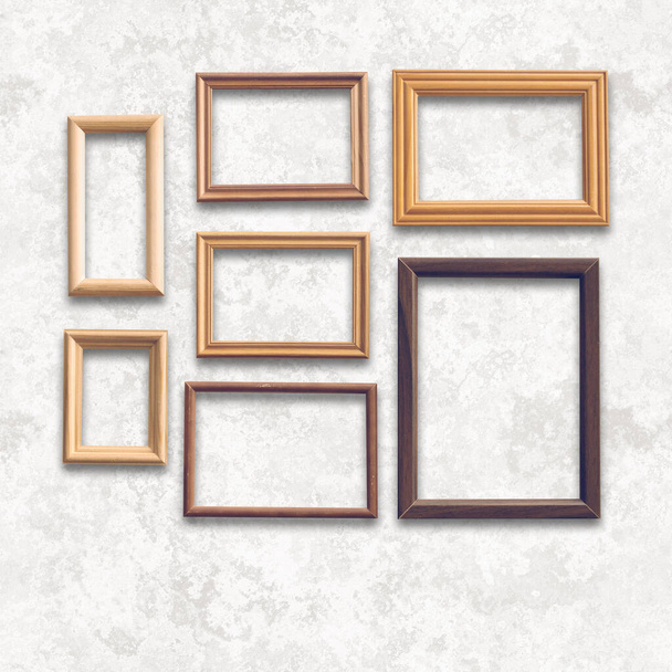 wooden photo frames on white wall - Фото, зображення