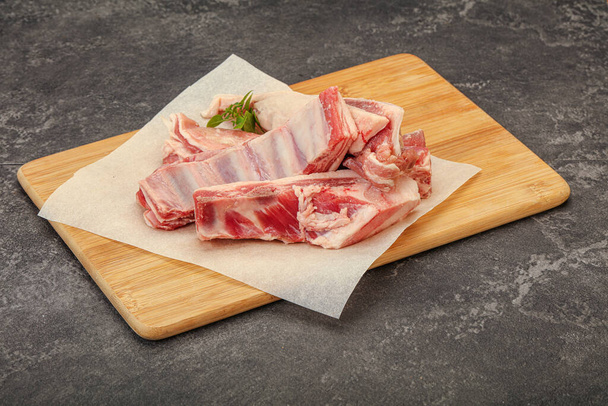 Raw lamb ribs served rosemary for cooking - Фото, изображение