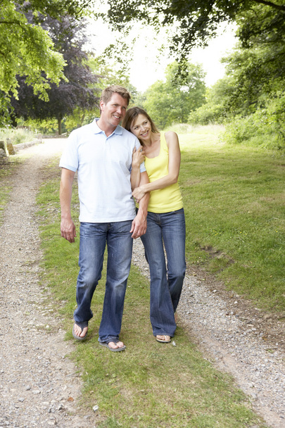 Middle aged couple walking in countryside - Foto, Imagem
