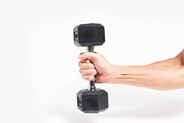 dumbbell in man's hand isolated on white background - 写真・画像