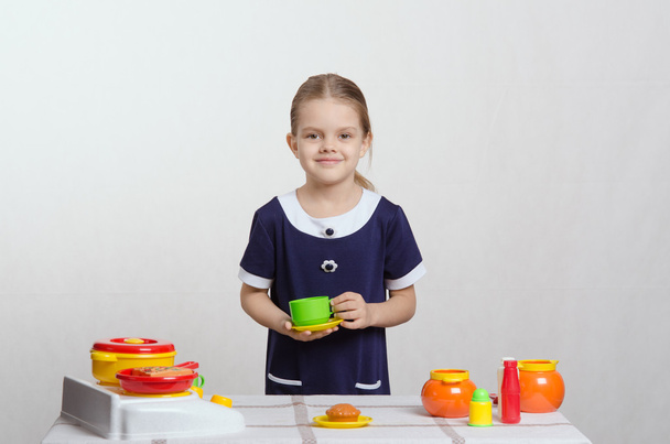 Girl playing toy dishes - Photo, Image