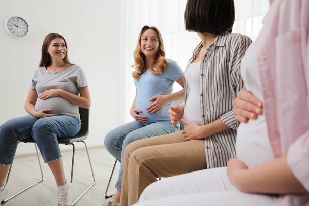 Group of pregnant women at courses for expectant mothers indoors - Fotoğraf, Görsel