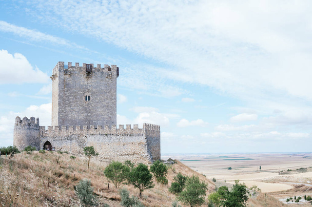 Tiedra Castle built in the 11th century with blue sky with clouds. Image with copy space. - Φωτογραφία, εικόνα