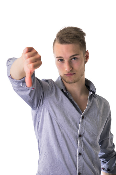 Handsome blond young man doing thumb down sign - Photo, image