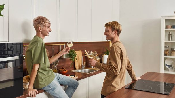 Homosexual male couple smiling at each other - Fotografie, Obrázek
