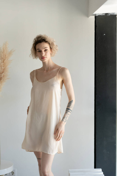 young beautiful woman pose in white lingerie in the studio - Foto, Bild