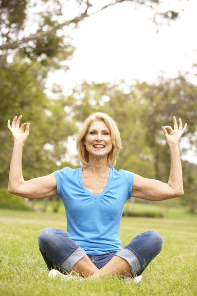 Senior Woman Doing Yoga In Park - Fotó, kép