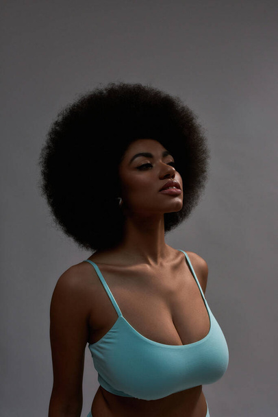 Portrait of young african american woman in blue bra - Фото, изображение