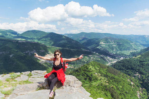 Tourist Woman with Backpack on the Top of Summer Mountain with Stunning View. Summer Mountain in Bulgaria, Bov Village, Balkan Mountain, Iskar Gorge - Φωτογραφία, εικόνα