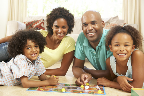 Family Playing Board Game At Home - Фото, зображення