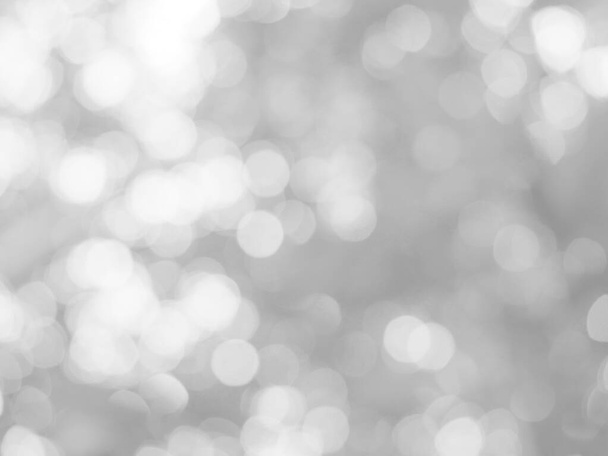 The glowing white bokeh image can be used as a background illustration or to add text to an advertisement. - 写真・画像