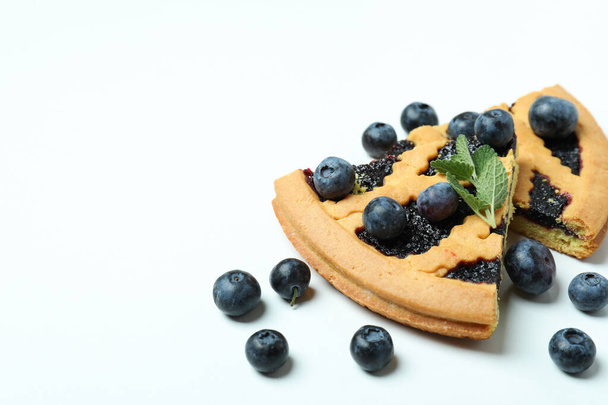 Pieces of blueberry pie with berries on white background - Photo, Image
