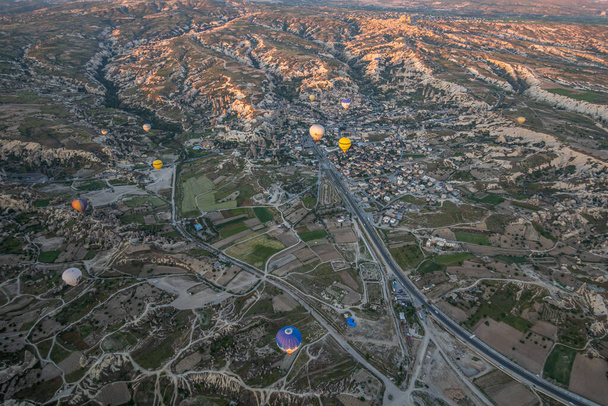 A big tourist attraction in Cappadocia is the hot air balloon ride. Cappadocia is known all over the world as one of the best destinations for hot air ballooning. Goreme, Cappadocia, Turkey. - Fotó, kép