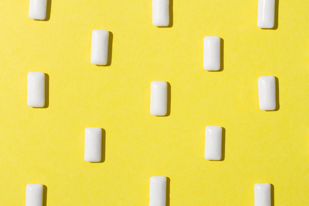 Gum are on the yellow background. - Photo, Image