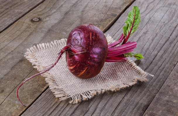 Organic beetroot over rustic wooden background - Photo, Image