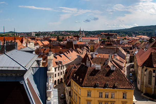 Sopron Hungary Jun 2 2018: Red roofs of the old town of Sopron seen from the Fire watch tower. Hungary. Sopron skyline. - Fotoğraf, Görsel