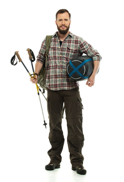 Traveler with backpack, hiking poles and sleeping bag  - Foto, Imagen