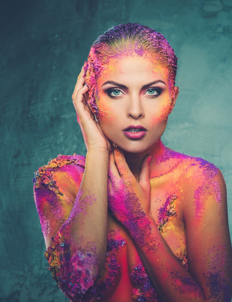 Beautiful young woman with conceptual colourful body art  - Photo, Image