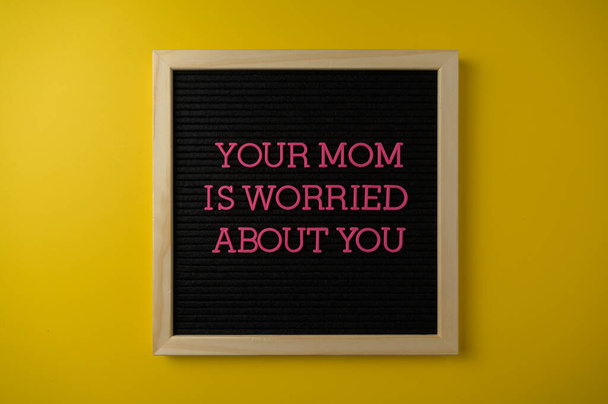 Your Mom Is Worried Sign on Yellow Background - Valokuva, kuva