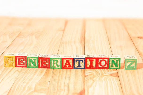 Spectacular wooden cubes with the word GENERATION Z on a wooden surface. - Photo, Image