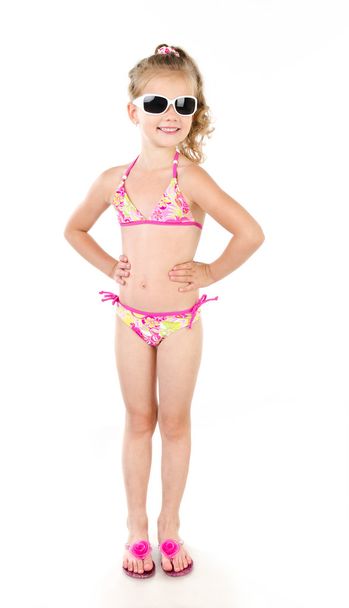 Cute smiling little girl in swimsuit isolated on a white - Foto, Imagen