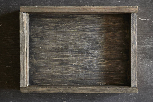 A studio photo of a black wooden box - Foto, Imagen