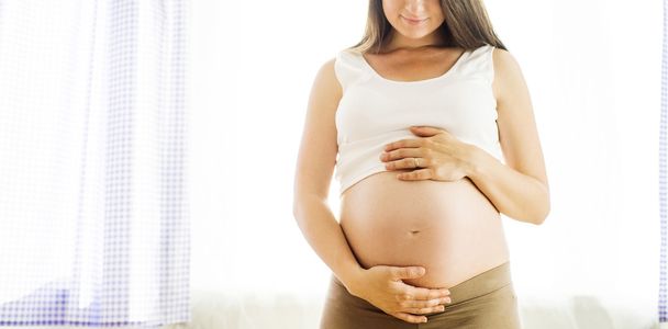 Pregnant woman holding her belly - Zdjęcie, obraz