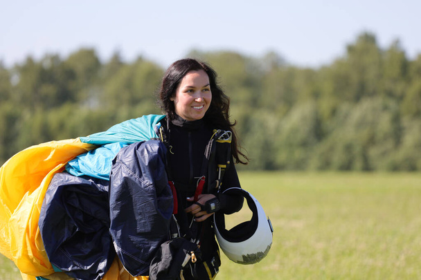 Skydiving. A happy woman is coming back after the jump. - Photo, Image