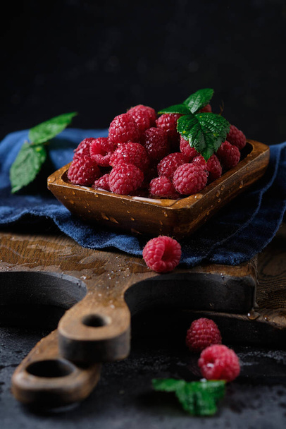 Fresh ripe raspberries in wooden bowl  - Photo, Image
