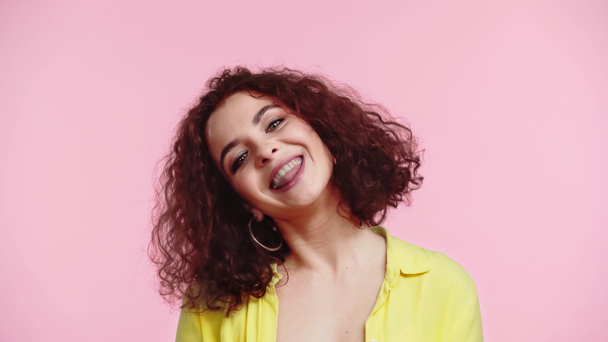 cheerful young and curly woman sticking out tongue isolated on pink  - Foto, Bild