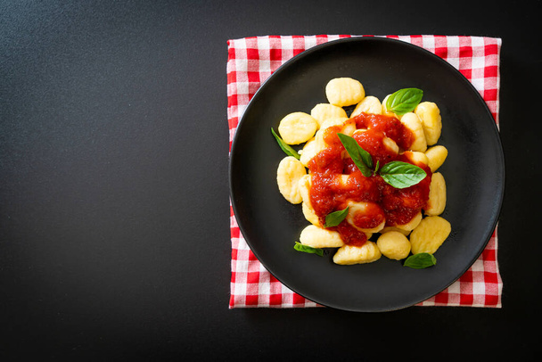 gnocchi in tomato sauce with cheese - Italian food style - Фото, изображение