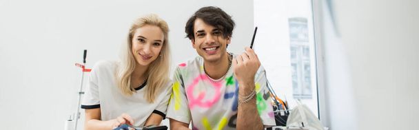 young, trendy designers smiling at camera in fashion atelier, banner - Fotoğraf, Görsel